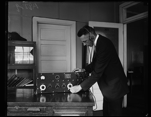 Man with radio receiver made for the U.S. Coast Guard