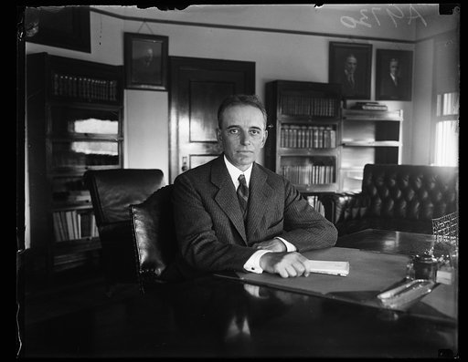 William D. Mitchell at desk