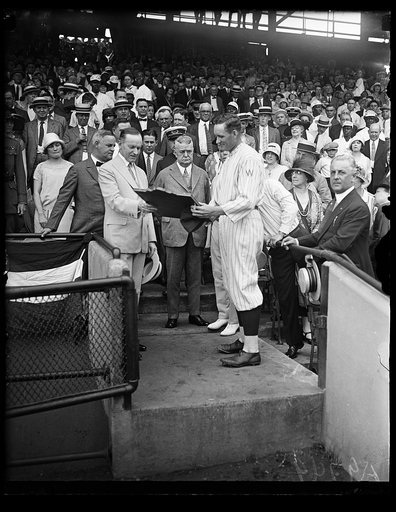 Calvin Coolidge and Walter Johnson in stands; Washington baseball