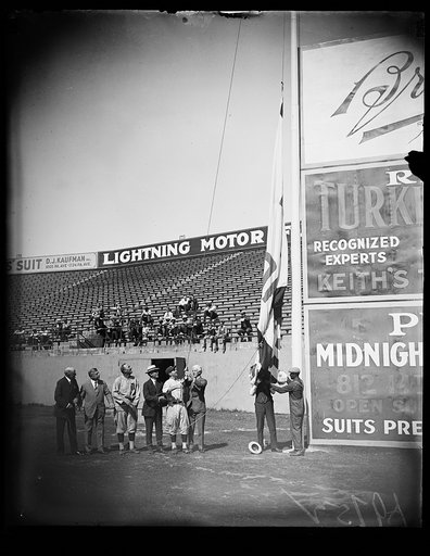 Group at flagpole at stadium