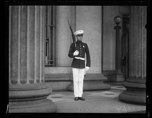 Guarding the U.S. Treasury. One of the detatchment of the U.S. Marines, dressed in full dress uniform with fixed bayonet, guarding the United States Treasury until after the Klan Parade on Saturday, August 8th
