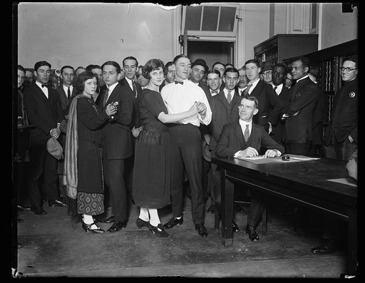 Fred Newman and Herbert Gately, shuffled their partners, Evelyn King and Thelma Reese, to the marriage license Bureau at City Hall today. They will be married tonight while competing in a marathon dance in Wash. When the picture was made they were on their 66th hour. All are from Balto. At the table