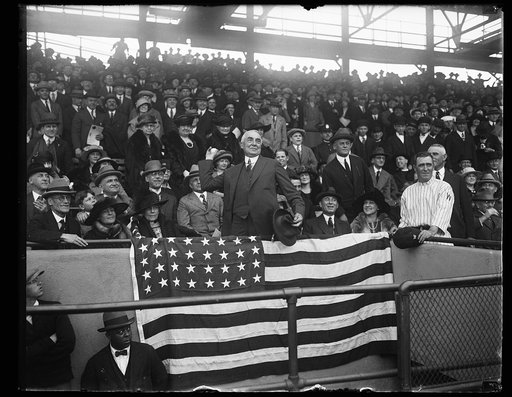 Warren Harding throwing baseball at Washington game