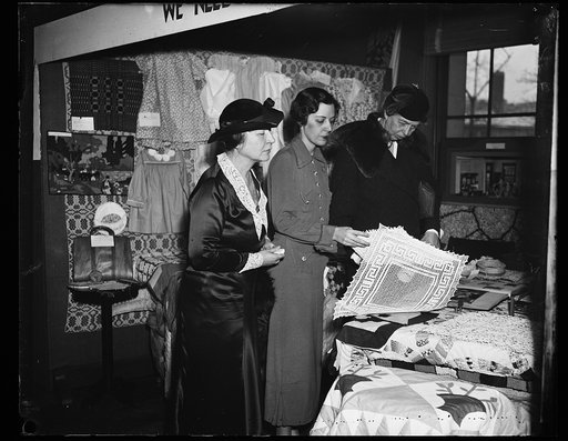 INSPECTS EXHIBIT. MRS. FRANKLIN D. ROOSEVELT, RIGHT, INSPECTS THE HOUSING EXHIBITION SPONSORED BY FEDERAL HOUSING AND THE FEDERAL HOME LOAN BANK BOARD. FROM THE LEFT: MRS. HELEN DEWEY HOFFMAN OF THE HOME LOAN BANK; MISS DOROTHY McKINNON, IN CHARGE OF THE HOME LOAN BANK; MISS DOROTHY McKINNON, IN CHA