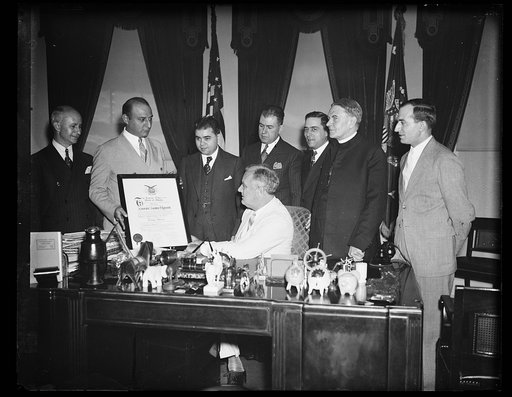 PRESIDENT RECEIVES FRATERNITY MEMBERSHIP SCROLL. WASHINGTON, D.C. JUNE 24. PRESIDENT ROOSEVELT TODAY RECEIVED A SCROLL REPRESENTING HIS MEMBERSHIP IN THE GREEK ORDER OF AHEPA. HE WAS INITIATED INTO THE ORDER MARCH 11, 1931, WHEN GOVERNOR OF NEW YORK. THE GREEK EDUCATIONAL ASSOCIATION MADE THE PRESEN