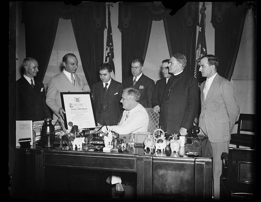 PRESIDENT RECEIVES FRATERNITY MEMBERSHIP SCROLL. WASHINGTON, D.C. JUNE 24. PRESIDENT ROOSEVELT TODAY RECEIVED A SCROLL REPRESENTING HIS MEMBERSHIP IN THE GREEK ORDER OF AHEPA. HE WAS INITIATED INTO THE ORDER MARCH 11, 1931, WHEN GOVERNOR OF NEW YORK. THE GREEK EDUCATIONAL ASSOCIATION MADE THE PRESEN