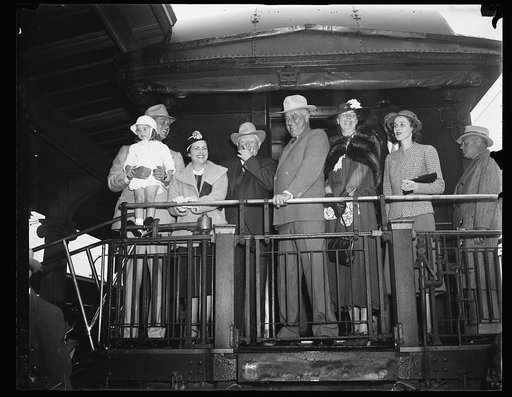 Group on back of train; includes John Nance Garner, Franklin D. Roosevelt, and Eleanor Roosevelt