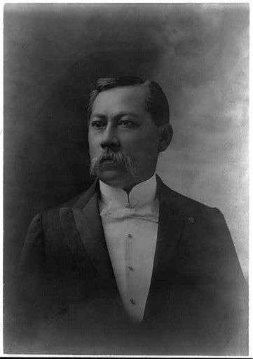 Portrait half of a Hawaiian businessman.