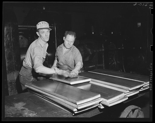 Brass for cartridges. Rolling out brass slabs is one of the first processes in manufacturing cartridge cases. The work is being performed at one of eleven Navy arsenals which are working at top speed to furnish ammunition for our two-ocean Navy