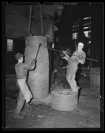 First stage in a big Navy gun. Forging part of a large gun in an eastern Navy yard arsenal. This is one of eleven arsenals which have stepped up production to top speed for the war program