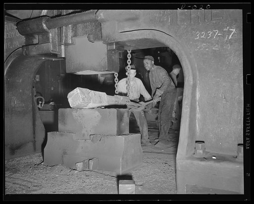 Mammoth weight of drop forger. Forging part of a large gun in an eastern Navy yard. This is one of eleven Navy arsenals which have stepped up production to top speed for the war program