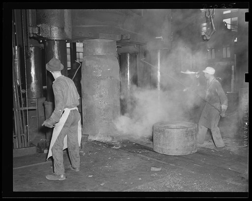 Birth of a big Navy gun. Red hot parts for a big gun being drop forged in an eastern Navy yard. This will end up as equipment for our new two-ocean fleet