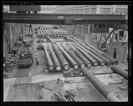 Guns for the Navy. Finished guns of large caliber awaiting shipment in an eastern Navy yard, one of eleven arsenals which are producing guns for the new two-ocean fleet
