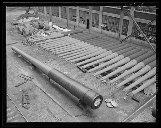 Guns in a gunyard. Finished guns of large caliber awaiting shipment in an eastern Navy yard, one of eleven arsenals which are producing guns for the new two-ocean fleet