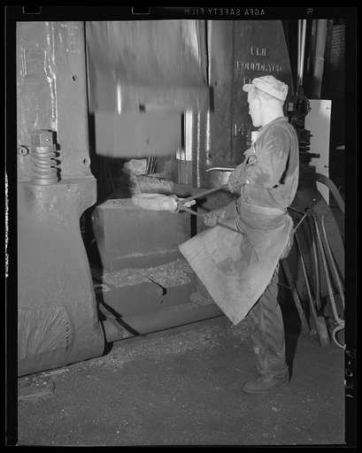 Small part for a big gun. Drop forging a part for one of the smaller guns being turned out in an eastern Navy yard. This is part of the war program calling for the completion of hundreds of new warships