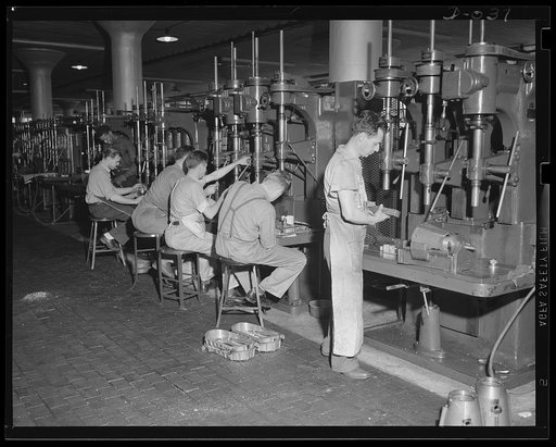 A forest of drills for the Navy. A few of the drills at work in an eastern Navy arsenal. Production has been speeded up to equip our two-ocean Navy