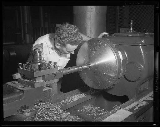 Power for torpedoes. Torpedo bulkhead on the heavy lathe at an eastern Navy arsenal. Production has speeded up to twenty-four hours a day for our two-ocean Navy