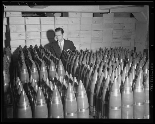 Thunder for the artillery. Thousands of these big shells are coming out of Army arsenals to supply the new guns. Location: an eastern arsenal producing at top speed