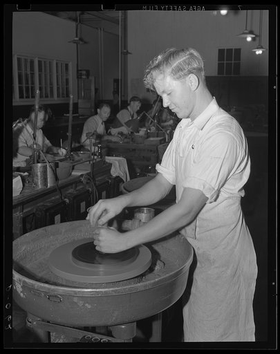 Rough grind of flawless glass. The first rough grinding of optical glass for the delicate aiming apparatus of the big guns. A large eastern arsenal turns these out as well as ammunition