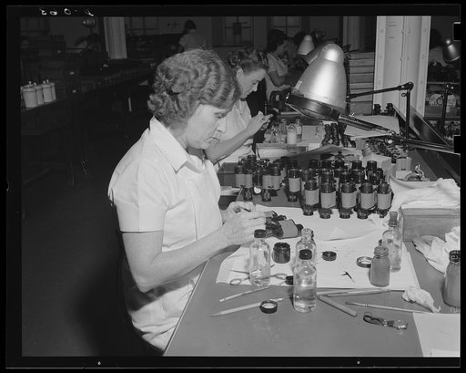 Far-sighted Army eyes. Assembly of standard field glasses for the Army at an eastern arsenal. Optical equipment is an important part of military requirements