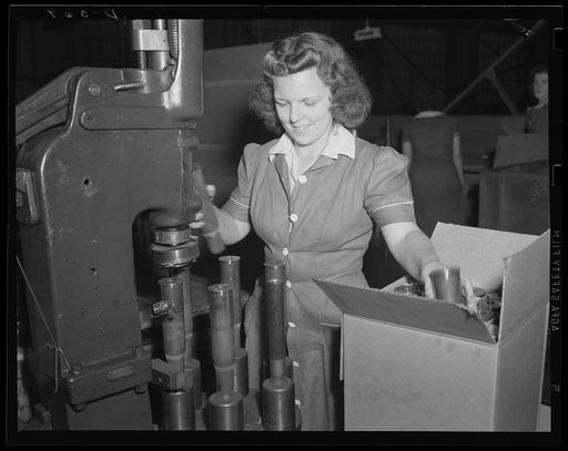 Packing a terrific wallop. Stamping and packing 75 mm cartridge cases for the artillery in an eastern arsenal