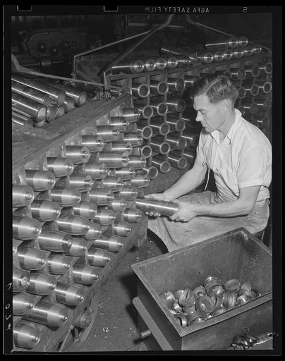 One gun spits 166 of these an hour. 75 mm shells stand as semi-finished ammunition in a large eastern arsenal, which is working at top capacity