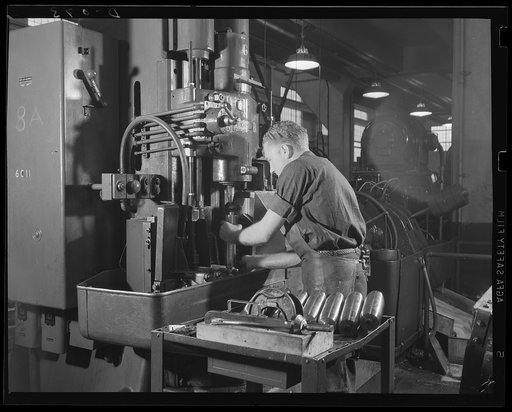 Fifteen-pound shells for light artillery. Finish turning 75 mm shells which are coming out of an eastern arsenal on a steady production line