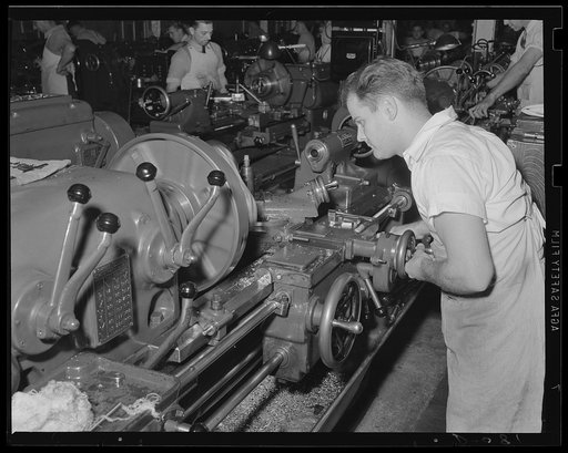 Machine that thinks. Turning and boring a quadrant bracket on one of the batteries of machines at a large Army arsenal working full speed for the war program