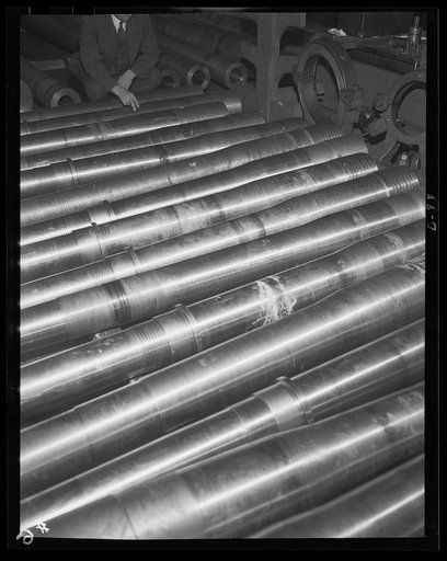 Equipment for a grim game. Medium-caliber guns roll in a growing stream from a large eastern arsenal as the war program reaches full schedule