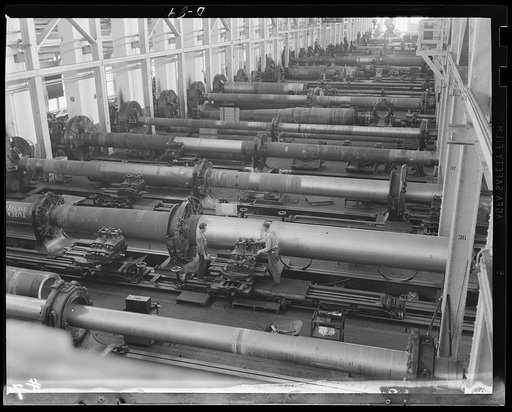 Voices for a mighty argument. A long line of big guns being rushed toward completion under the war production program. Guns shown here are being turned out in the major caliber shop of a large eastern arsenal