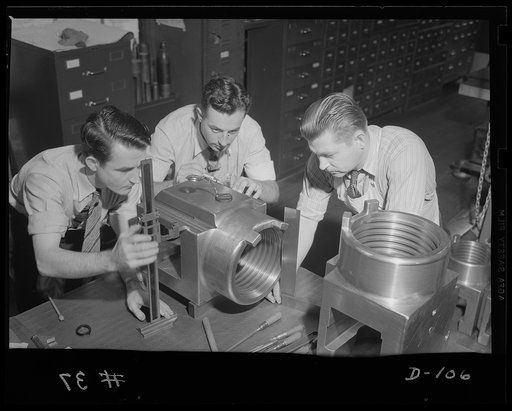 Check and triple check. Final inspection of breach rings for medium caliber guns in an eastern arsenal. Greatest accuracy marks production in the war program