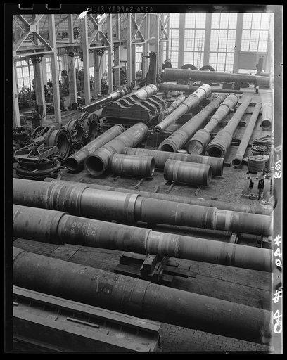 Covering the compass. Partially-completed big guns point North, East, South and West toward our borders as they await finishing operations in a large eastern arsenal