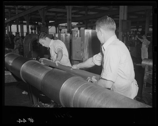 Taking care of the kick-back. Recoil rails are assembled for a medium caliber gun rushed for the war production program in an eastern arsenal