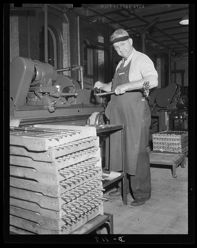 It has to be right. Gauging the diameter of the barrel of a Garand rifle following grinding. An eastern armory is turning out these rifles for the war program