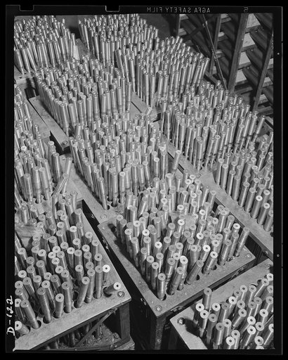 Guns--plenty of 'em. Masses of gun barrels in the process of manufacture for the war program
