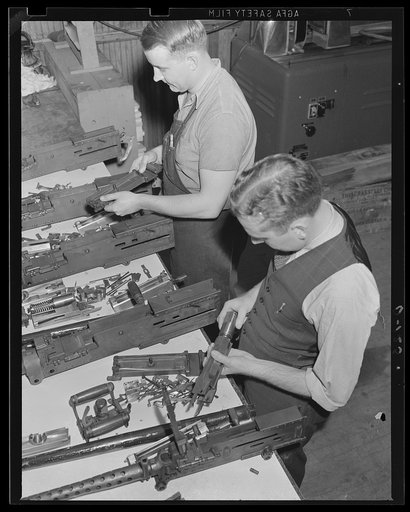 War program keeps its eye on the ballistics. These 50 caliber machine guns are being inspected in the ballistics laboratory at an eastern armory
