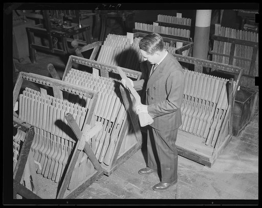 Ready for a bath. Ready for a bath in oil are these gun stocks. The oil will preserve them in the strenuous days ahead in war work