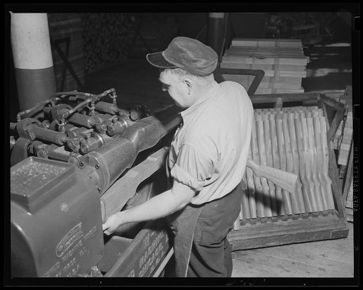 Automatic machines. Automatic machines have time and labor in the war program. This modern copying lathe takes a rough rifle stock and turns it to its final shape