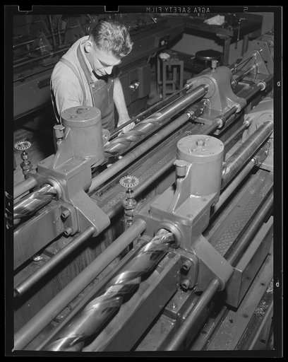 War work in the groove. A modern rifling machine cutting the grooves in a gun barrel
