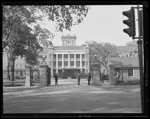 Gate of guns. Main entrance to the Administration building at an eastern armory, now turning out guns for the war program