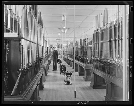 From brown Bess to the Chicago typewriter. Part of the collection of small arms at an eastern armory, where a long tradition of gun-making is being brought to bear in the war program