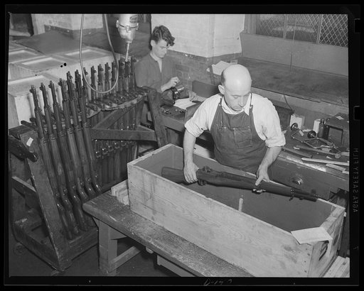 Garand rifles being packed for shipment to troops in training