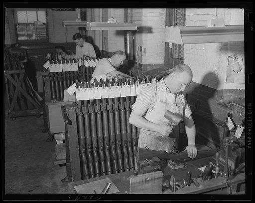 One last checkup. One last checkup is being given these Garand Rifles, following proof firing activity at an eastern armory