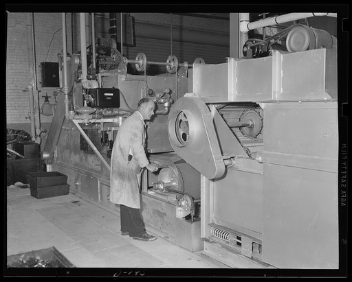 Tempered to take it. This elaborate machine is an important war worker. It heat treats and tempers gun parts at an eastern armory