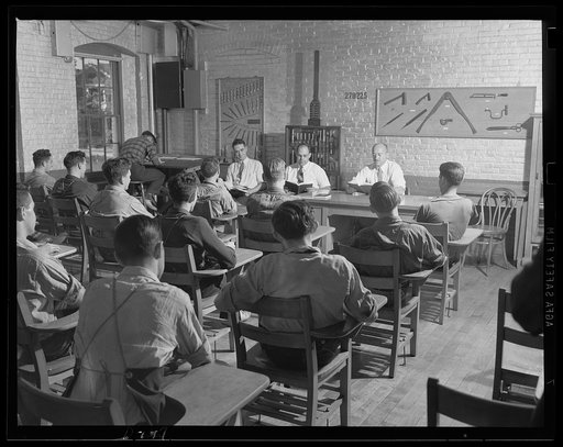 Learning how. The war production program means school to these boys. Class work is part of their training to be expert tool and die makers