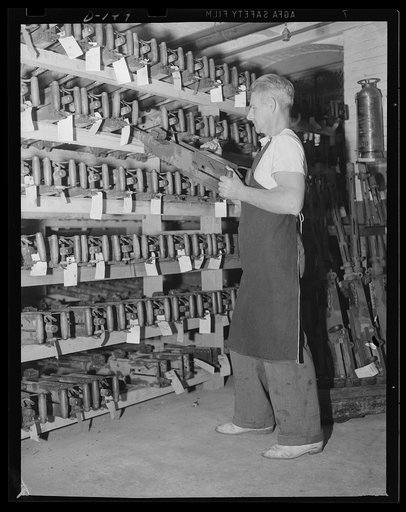 Row on row. Row on row of .50 caliber machine guns, turned out for the war program