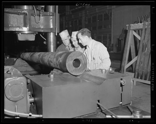 Barrel building. Straightening press for gun taken prior to machining. This is one of the operations speeded up for war work in an eastern arsenal
