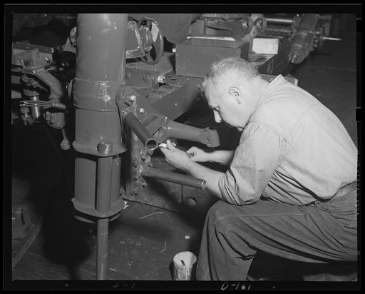 Trouble for warbirds. The buffer cylinder to a 37 mm anti-craft gun carriage chassis is assembled in an eastern arsenal. Production of these guns in quantities under the war program bodes no good to an unfriendly aircraft