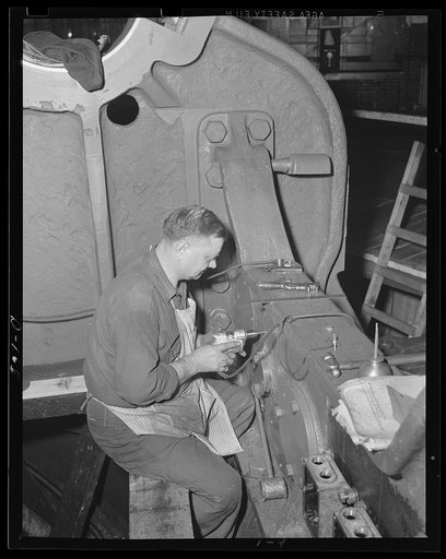 Military drill. Cutting holes on front transom for 16-inch gun barbette carriage in an eastern arsenal
