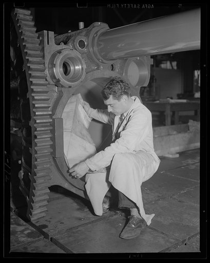 Nearly ready. Checking the dimensions of the finished cradle for an 8-inch gun, railway carriage. This is one of the first operations on the gun, being built in an eastern arsenal